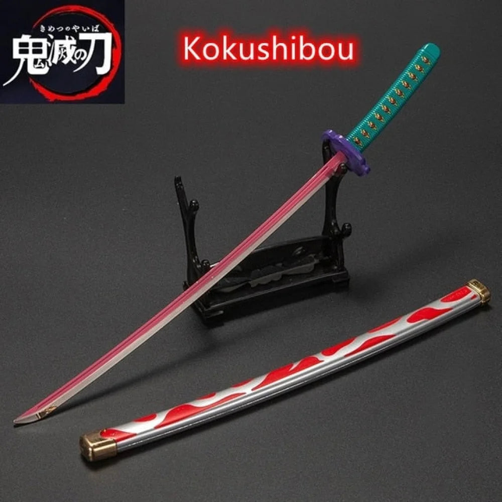Demon Slayer / Kimetsu No Yaiba - Katana 25Cm In Metallo Ornamentale Katane & Spade